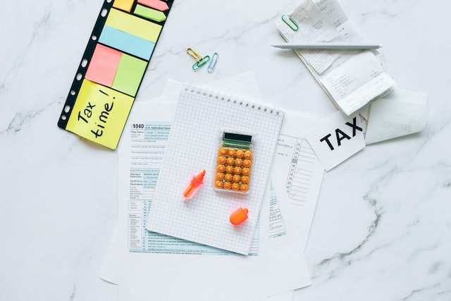 a%20bunch%20of%20tax%20forms%20and%20receipts%20on%20a%20white%20table a%20bunch%20of%20tax%20forms%20and%20receipts%20on%20a%20white%20table